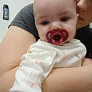 Natalie joined the competition — help win amazing prizes! baby, infant, pacifier, adult, arm, onesie, animal_pattern, bathroom, shampoo_bottle, closeup, portrait, holding, face, eyes, mouth, nose, skin, selfie, cuddling, sitting