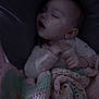 baby, infant, sleeping_baby, blanket, crochet_blanket, cozy, asleep, mouth_open, closed_eyes, hand, pajamas, bedding, crib_or_seat, portrait, night, low_light, soft_light, indoor, newborn, baby_clothing