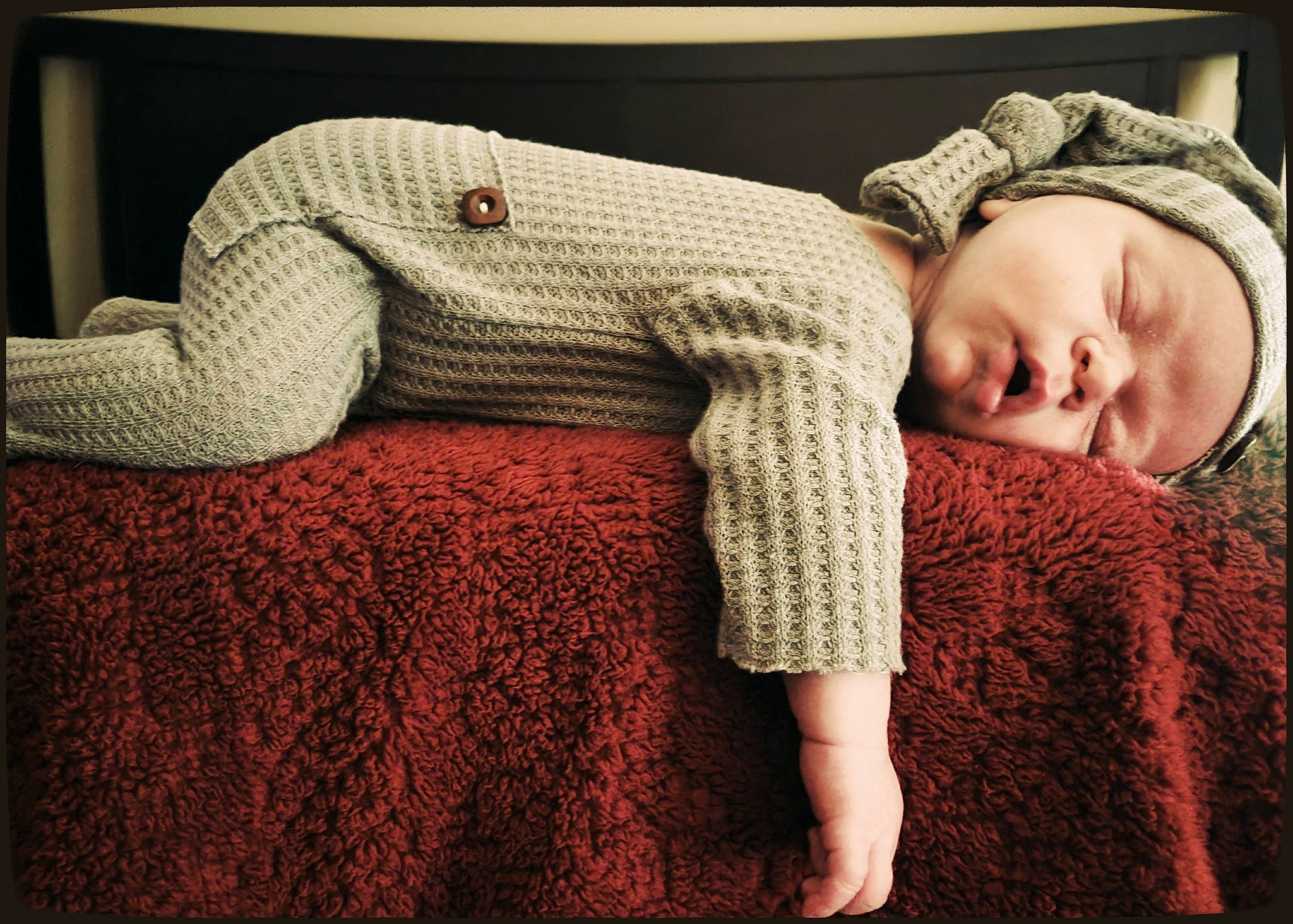 Kyler is registered to the contest to win money with this photo: bedding, child, comfort, craft, creative_arts, fashion_accessory, flooring, fur, grass, headgear, headwear, human_leg, linens, pattern, person, rectangle, room, sleeve, textile, wood