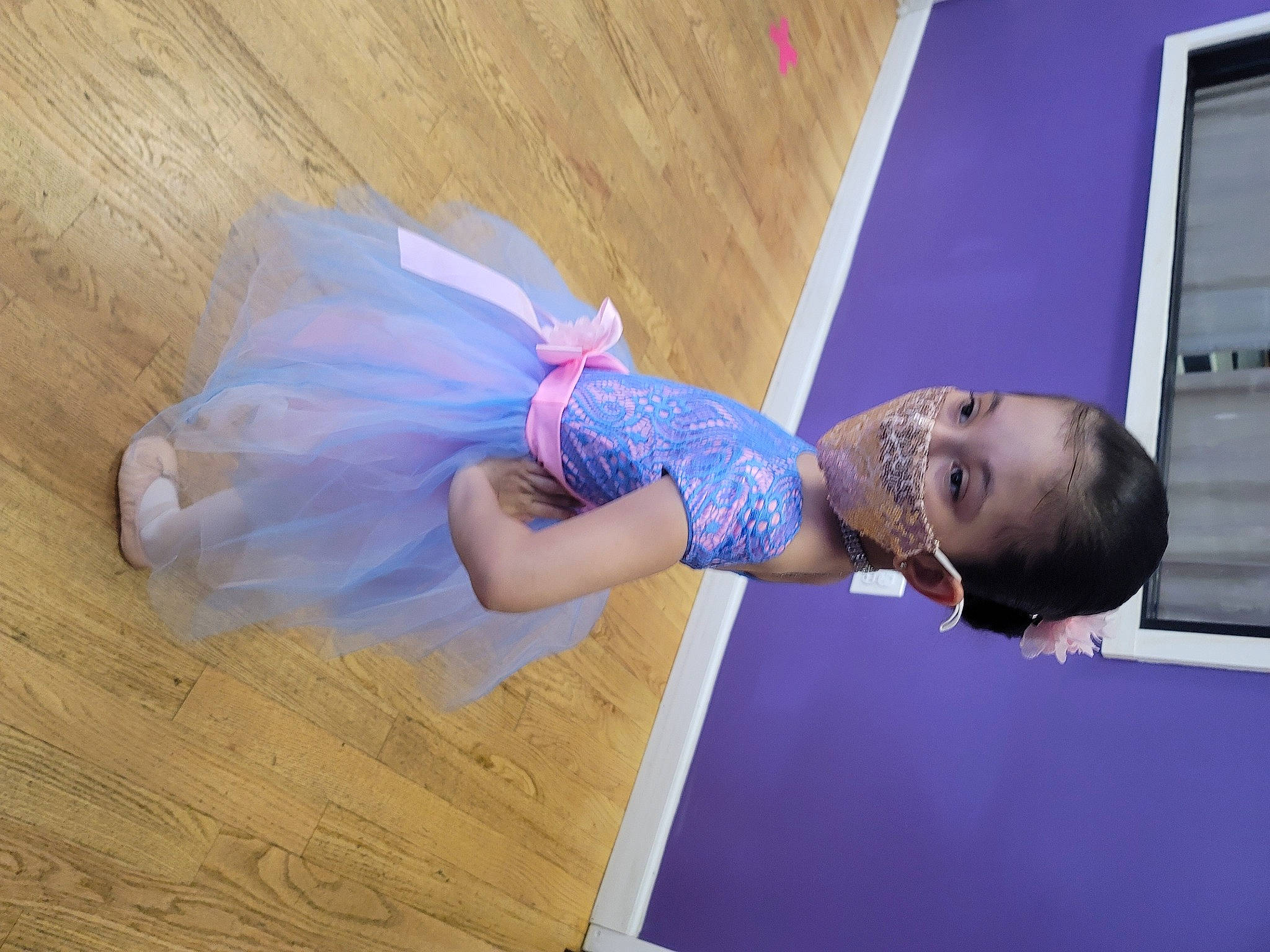 Isabella is registered to the contest to win money with this photo: abdomen, dress, elbow, electric_blue, event, flooring, fun, hardwood, human_leg, knee, performing_arts, person, purple, room, sportswear, thigh, waist, wood, wood_flooring, wood_stain