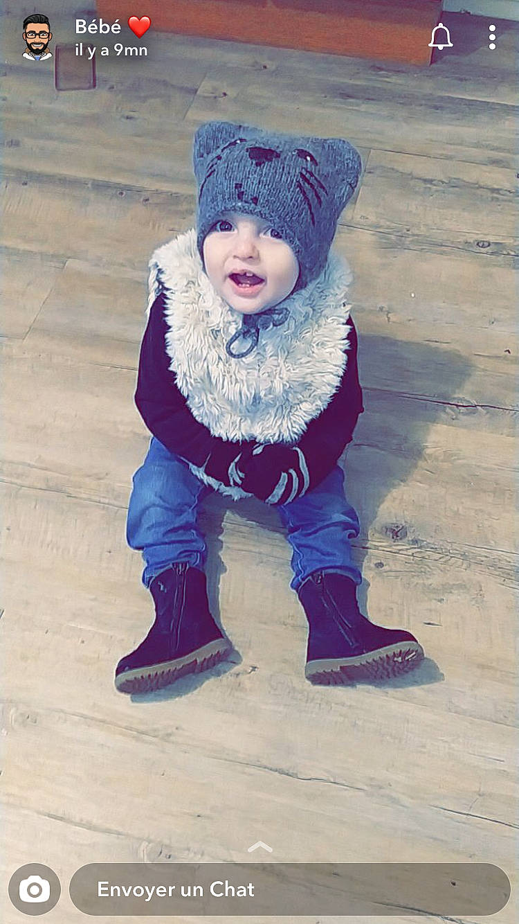 Lénah participe au concours pour gagner de l'argent avec cette photo : baby, baby_toddler_clothing, beanie, bonnet, boot, cheek, child, child_model, cool, costume_accessory, fur, headwear, hood, jacket, knit_cap, person, snow_boot, street_fashion, toddler, winter