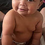 Mabel joined the competition — help win amazing prizes! baby, infant, smile, face, skin, eyes, cheeks, arm, hand, foot, diaper, person, cute, child, indoors, portrait, closeup, happy, sitting, skin_tone