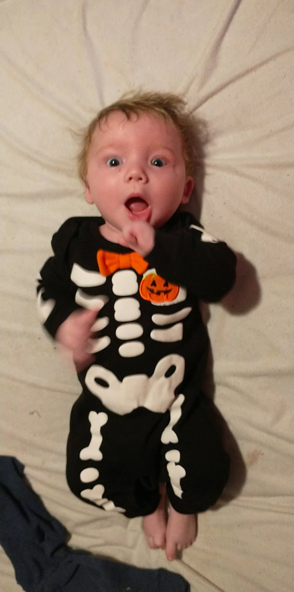 Keanu is registered to the contest to win money with this photo: baby, baby_products, baby_toddler_clothing, baby_toys, carmine, cheek, child, face, flooring, fun, head, organ, pattern, person, play, sitting, sleeve, surprise, t_shirt, toddler