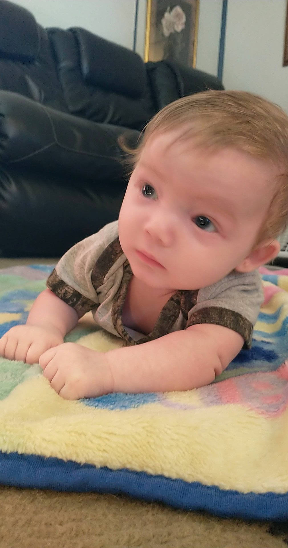 Keanu is registered to the contest to win money with this photo: baby, baby_toddler_clothing, cheek, chin, comfort, eye, face, finger, floor, flooring, head, iris, mammal, nose, person, product, skin, sleeve, toddler, vertebrate