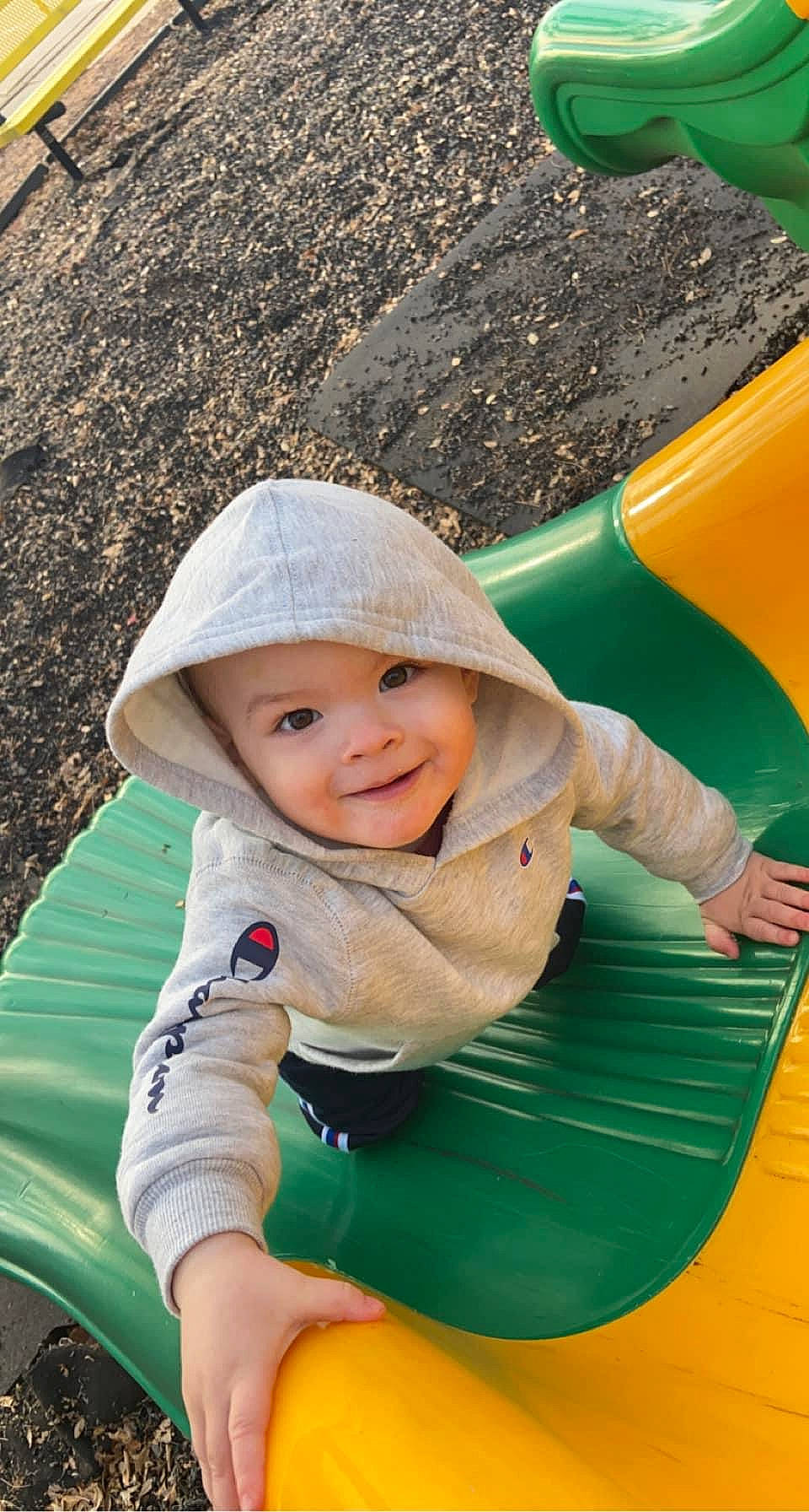 Jaxtyn is registered to the contest to win money with this photo: baby, child, chute, fun, grass, green, happy, headwear, joy, leaf, leisure, people_in_nature, person, photograph, playground_slide, product, recreation, skin, smile, snapshot