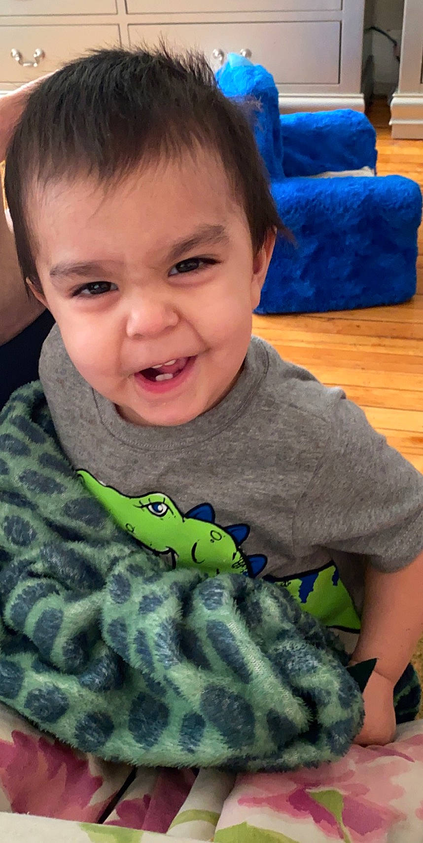 Zaiden is registered to the contest to win money with this photo: baby, caterpillar, cheek, child, eye, face, finger, head, mouth, neck, nose, person, play, smile, toddler, toy