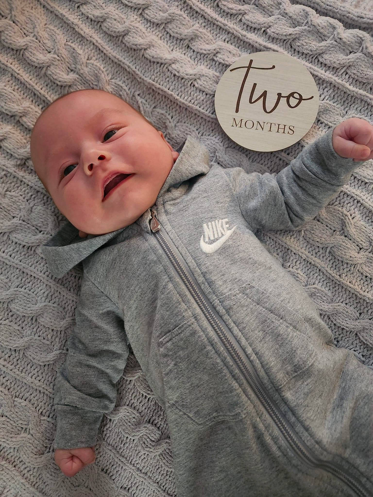 Kashton joined the competition — help win amazing prizes! baby, baby_toddler_clothing, button, child, comfort, font, gesture, grass, grey, happy, linens, outerwear, pattern, person, portrait_photography, skin, sleeve, smile, textile, toddler