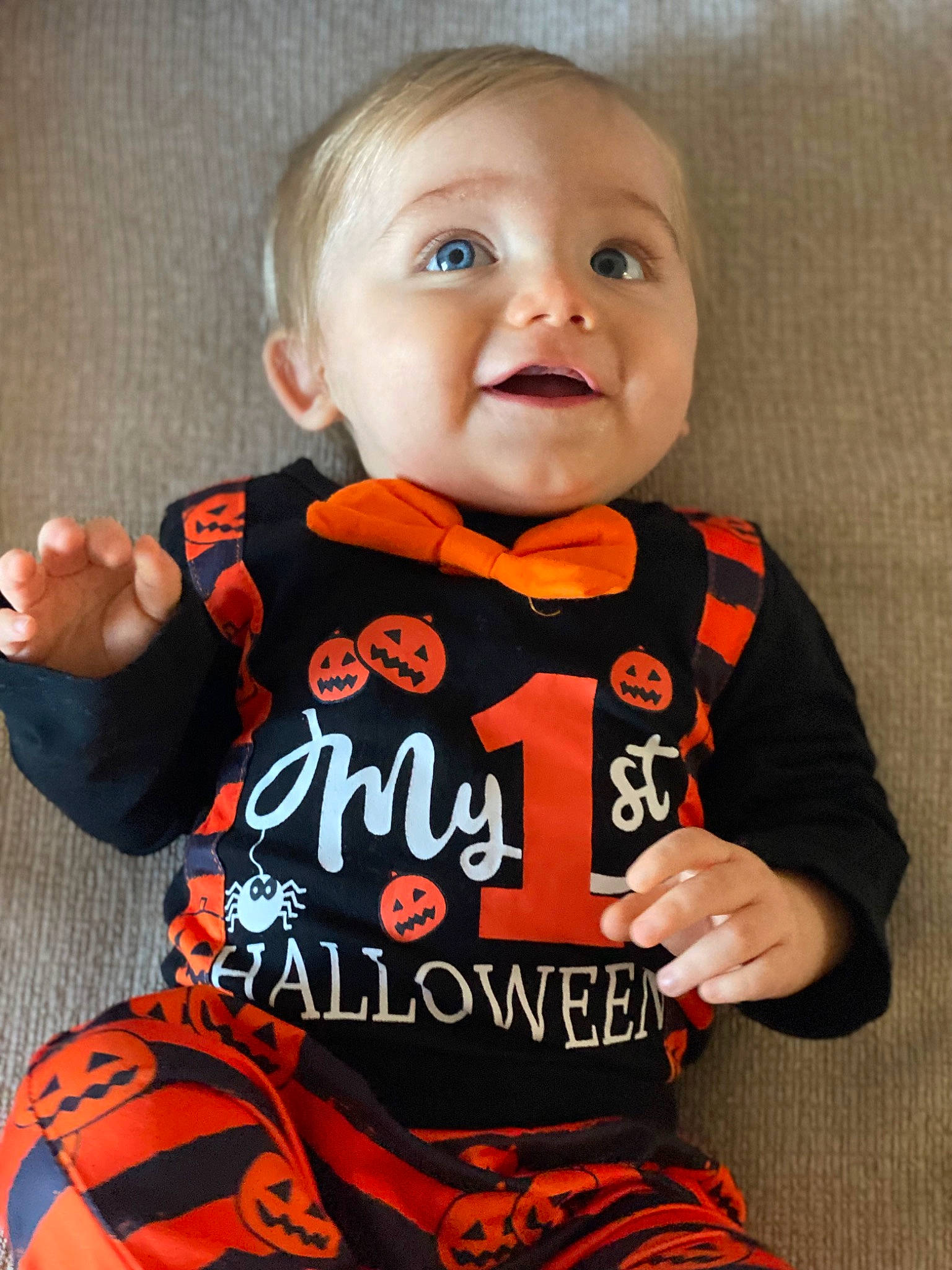 Carmine joined the competition — help win amazing prizes! baby, baby_toddler_clothing, cheek, child, finger, gesture, happy, jersey, long_sleeved_t_shirt, neck, orange, outerwear, pattern, person, sitting, sleeve, smile, sportswear, t_shirt, toddler