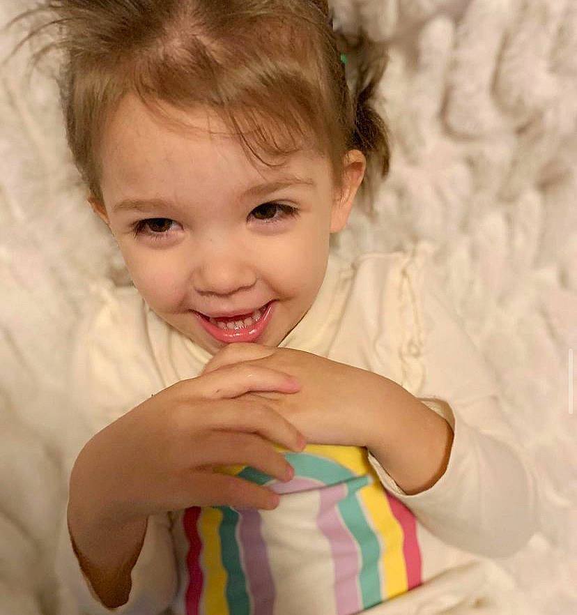 Madilyn Grace is registered to the contest to win money with this photo: baby_toddler_clothing, cheek, dress, eye, eyebrow, eyelash, facial_expression, gesture, hair, happy, head, iris, joy, lip, mammal, neck, nose, person, skin, sleeve