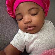 Bailee is registered to the contest to win money with this photo: baby, sleeping, pink_bonnet, white_shirt, blanket, infant, child, peaceful, face, closed_eyes, soft_texture, indoors, portrait, cute, resting, young_child, cozy, headwear, toddler, comfort