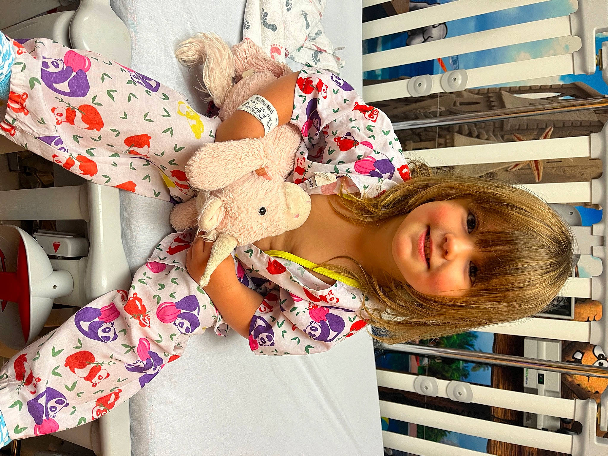 Juliette is registered to the contest to win money with this photo: building, carmine, child, doll, fun, happy, holiday, joy, leisure, linens, pattern, person, pink, plush, selfie, smile, stuffed_toy, sunglasses, t_shirt, toy