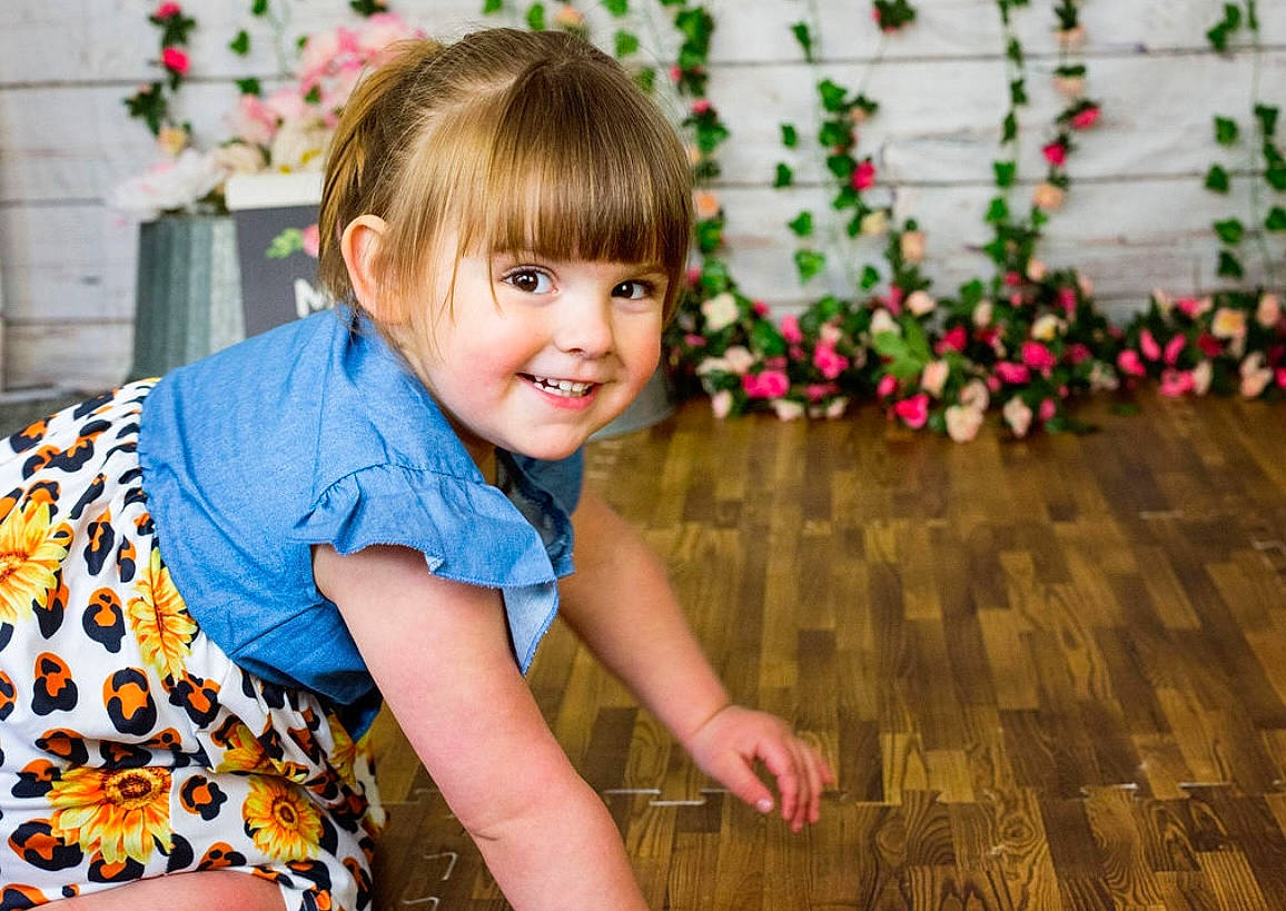 Juliette is registered to the contest to win money with this photo: arm, baby_toddler_clothing, child, clothing, eye, flash_photography, flooring, grass, hair, happy, iris, joy, leisure, pattern, people_in_nature, person, plant, skin, sleeve, smile