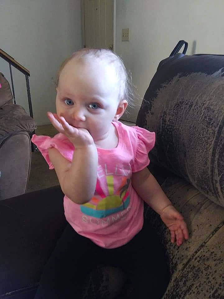 Carley is registered to the contest to win money with this photo: baby, cheek, chin, eye, eyebrow, eyelash, face, finger, gesture, head, human_body, iris, lip, mouth, neck, nose, person, pink, shoulder, skin