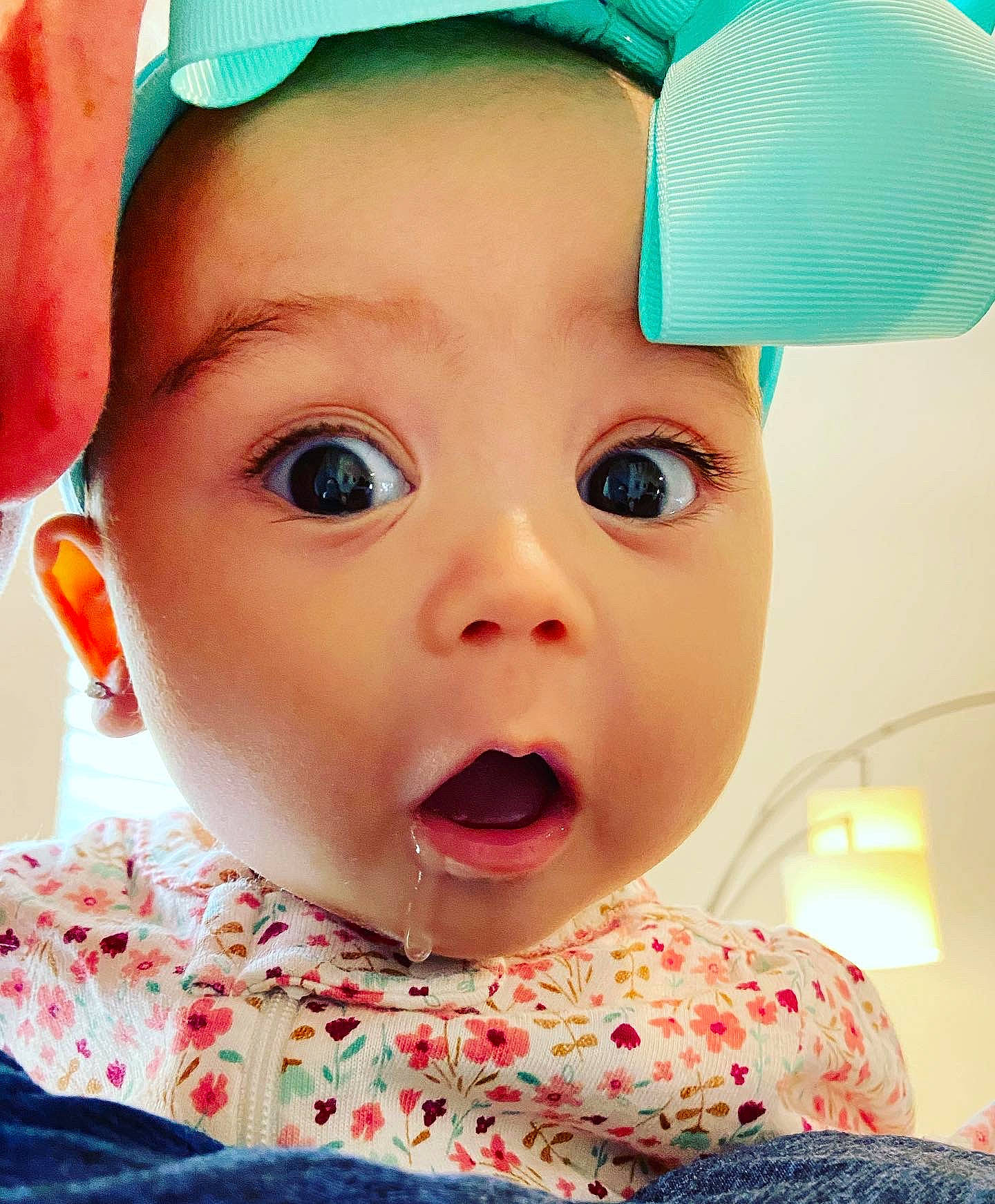 Molly joined the competition — help win amazing prizes! baby, baby_toddler_clothing, blue, cap, cheek, eye, eyebrow, eyelash, happy, head, headgear, iris, lip, mouth, nose, person, pink, skin, surprise, textile