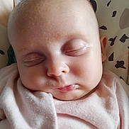 Rue joined the competition — help win amazing prizes! baby, blanket, bodypart, bonnet, clothing, face, finger, frown, hand, hat, head, newborn, person, photography, portrait, quilt, sad, skin, sleeping, towel