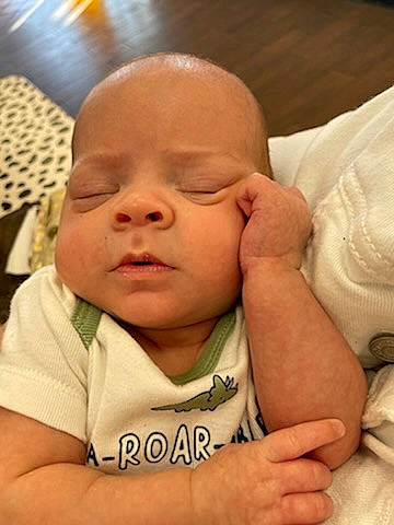 Brixton joined the competition — help win amazing prizes! baby, cheek, chin, comfort, eye, eyebrow, eyelash, finger, forehead, gesture, hand, happy, iris, lip, mouth, neck, nose, person, skin, sleeve