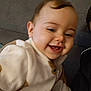 Eileen participe au concours pour gagner de l'argent avec cette photo : baby, child, couch, cozy, cute, eyebrows, face, fleece_jacket, furniture, happy, head, indoor, infant, person, portrait, sitting, skin, smiling, warm_clothing, young_child