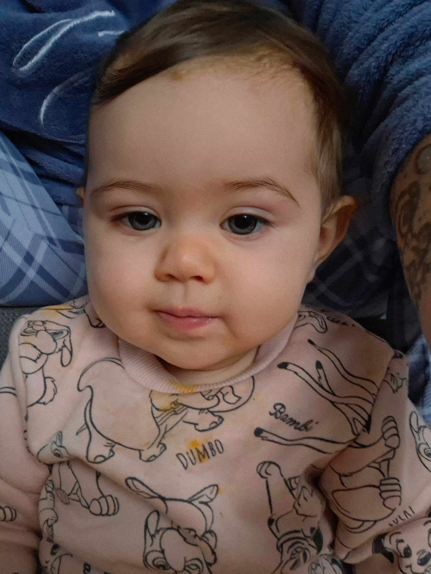 Eileen participe au concours pour gagner de l'argent avec cette photo : baby, bambi, blue_background, cartoon, child, closeup, clothing, comfortable, cute, dumbo, face, indoors, infant, person, pink, portrait, soft_light, sweater, tattoo, young