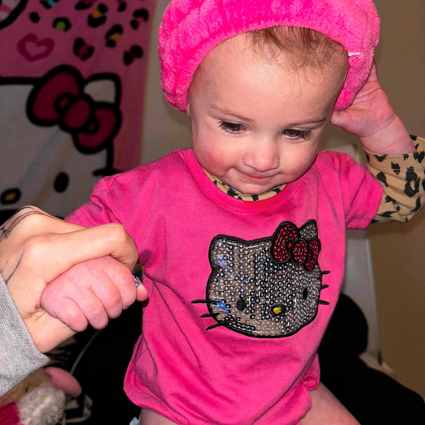 Athena joined the competition — help win amazing prizes! accessories, baby, bodypart, bonnet, bracelet, cap, clothing, face, finger, glove, hand, happy, hat, head, person, photography, portrait, purple, smile, t_shirt