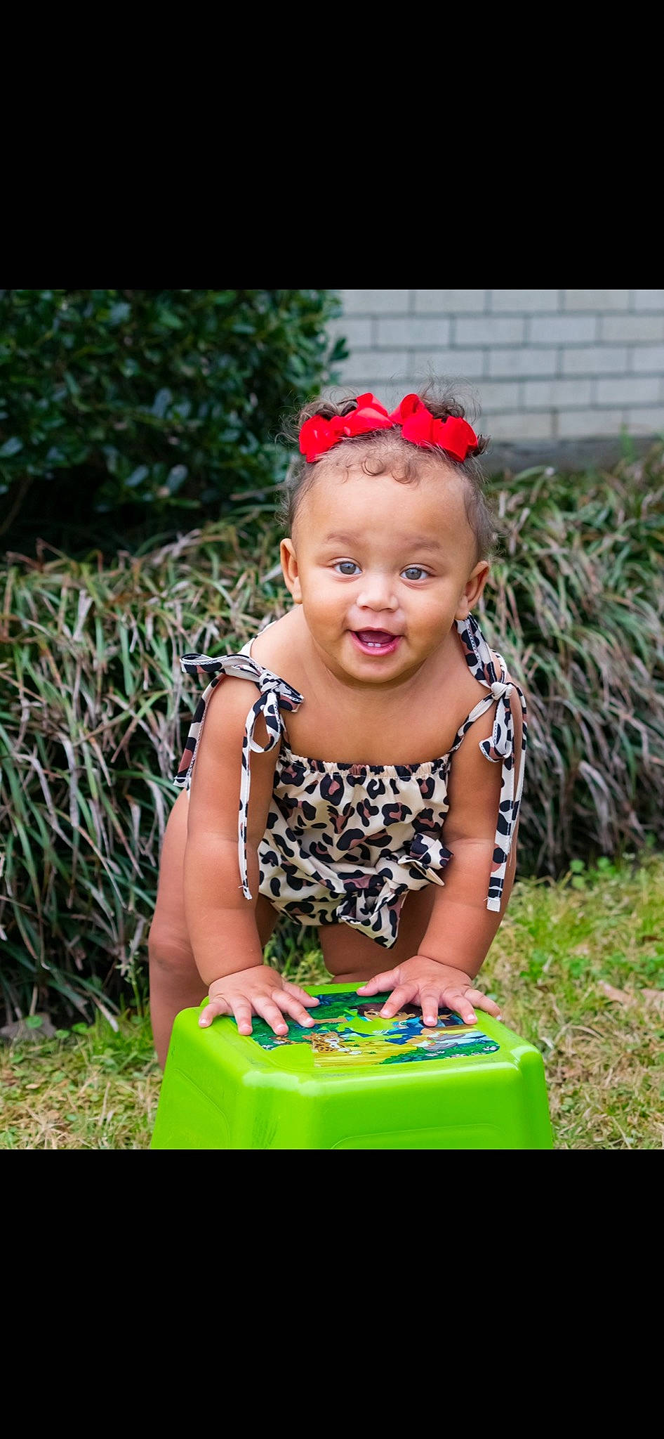 Alonni Kalise joined the competition — help win amazing prizes! baby, baby_toddler_clothing, child, dress, event, fun, grass, happy, jewellery, leisure, magenta, necklace, pattern, people_in_nature, person, pink, plant, recreation, sitting, smile