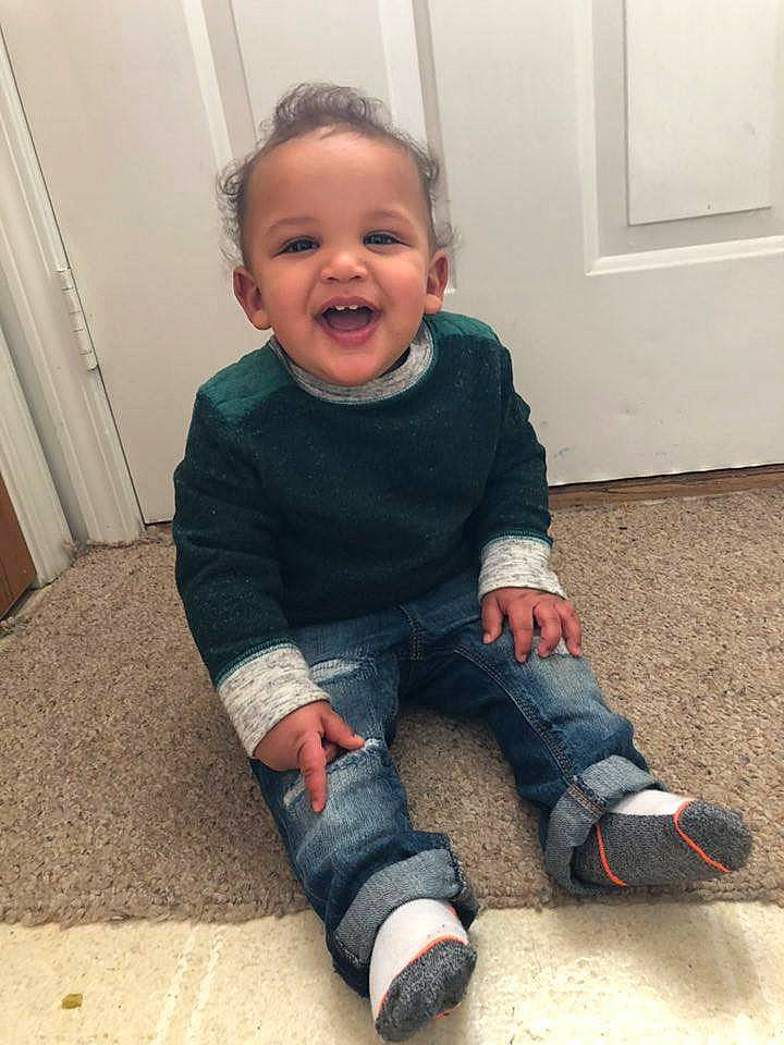 Ibrahim joined the competition — help win amazing prizes! arm, baby, cheek, child, face, facial_expression, floor, flooring, footwear, head, jeans, leg, nose, outerwear, person, shoe, sitting, skin, smile, standing