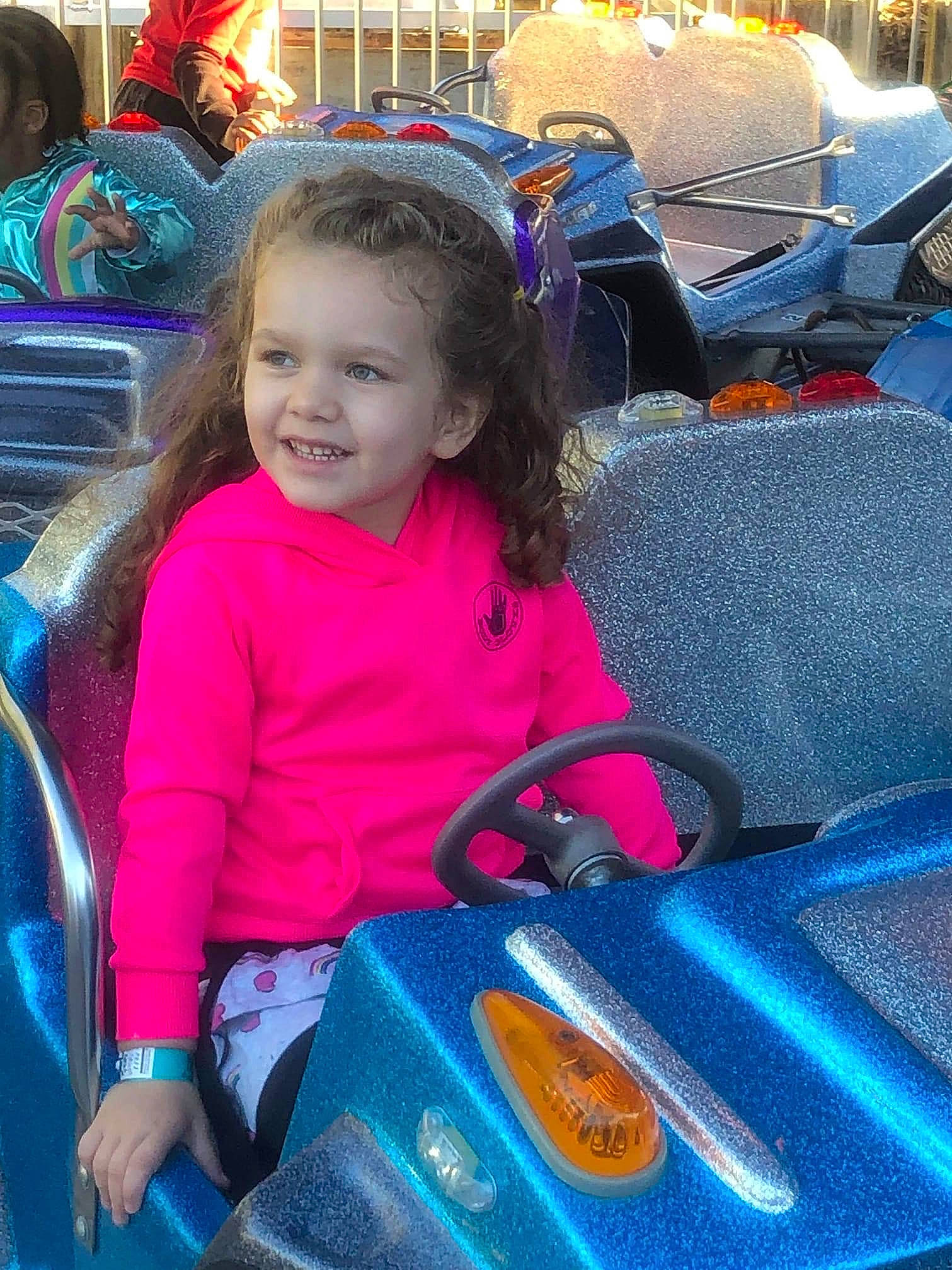 Kyra is registered to the contest to win money with this photo: child, electric_blue, fun, joy, leisure, person, play, product, smile, toddler, under_exposed, vacation