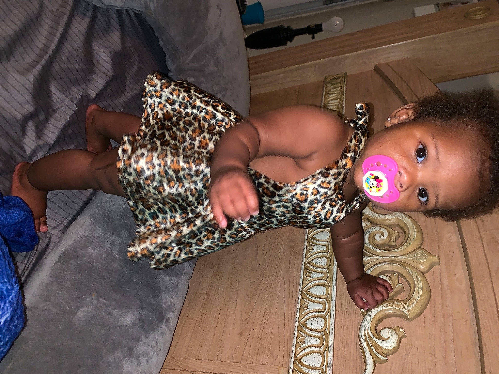 Ariya is registered to the contest to win money with this photo: abdomen, chest, child, fashion_design, flash_photography, flesh, flooring, fun, hardwood, human_leg, jewellery, nail, pattern, person, sitting, textile, thigh, toddler, trunk, wood