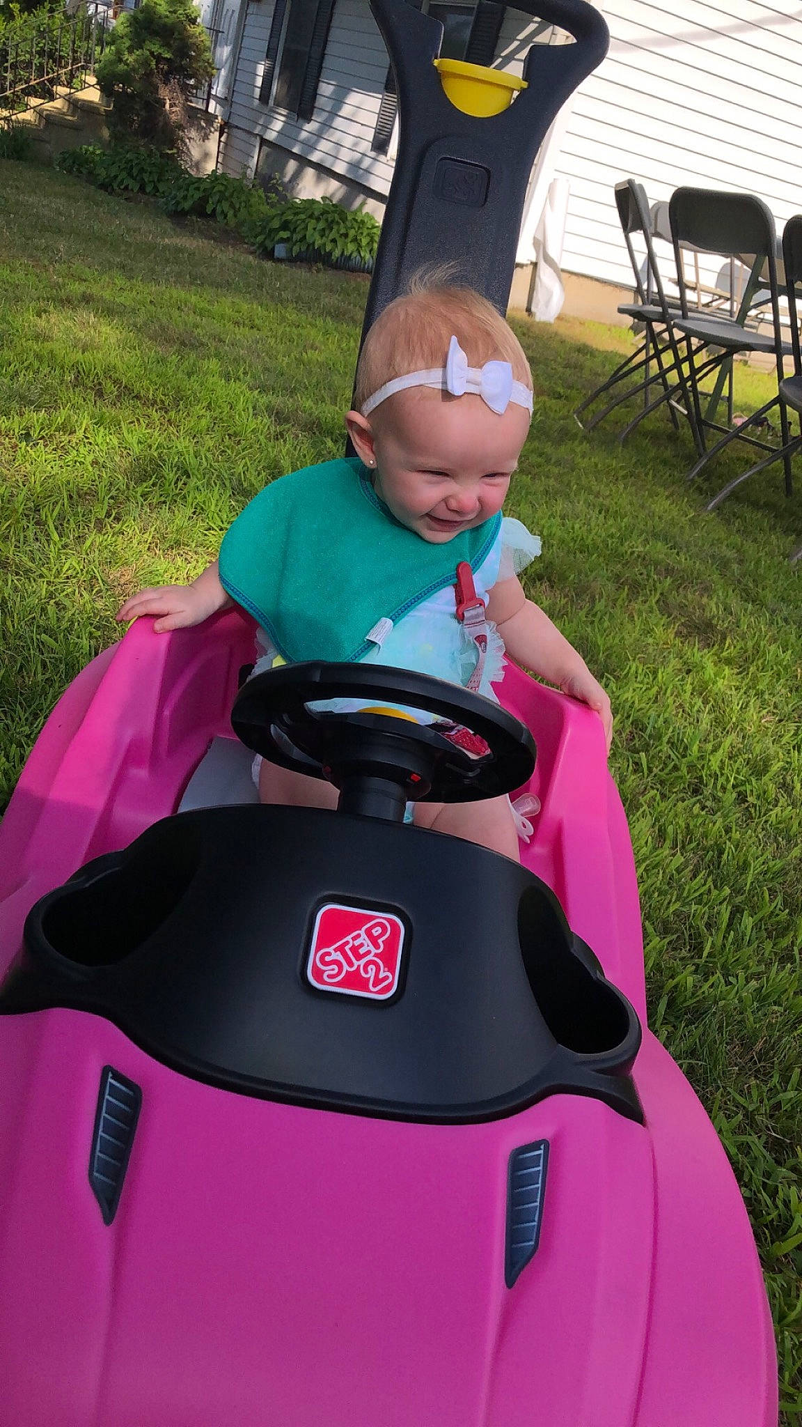 Elyana is registered to the contest to win money with this photo: fun, grass, joy, lawn, lawn_mower, magenta, mower, outdoor_power_equipment, person, pink, vehicle