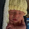 baby, newborn, sleeping, hat, knitted_hat, blanket, yellow, soft, cozy, infant, peaceful, cute, sleep, child, portrait, hand, skin, indoors, wooden_background, closeup