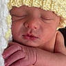 newborn, baby, sleeping, hat, knitted_hat, yellow, blanket, hand, skin, face, peaceful, closeup, infant, child, cute, soft, resting, portrait, indoors, toddler
