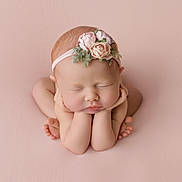 Ellie is registered to the contest to win money with this photo: newborn, baby, sleeping, flower_headband, pink_background, peaceful, portrait, infant, cute, hands, legs, skin, head, closed_eyes, soft_light, studio, pose, toddler, child, innocence