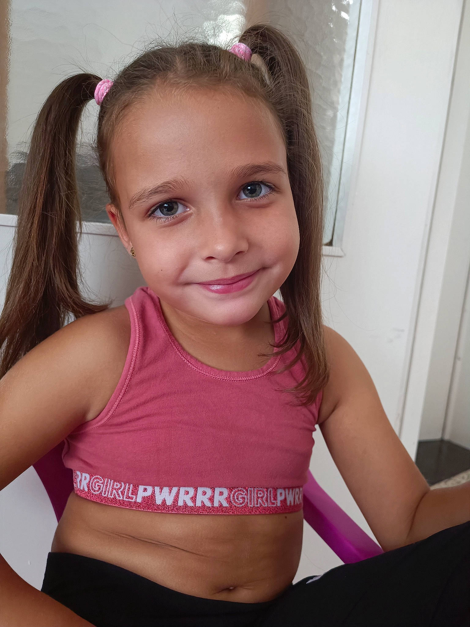 Layla participe au concours pour gagner de l'argent avec cette photo : active_tank, black_hair, cheek, chest, chin, eyebrow, eyelash, facial_expression, fun, hair, happy, joy, long_hair, neck, person, pink, shoulder, sleeveless_shirt, smile, thigh