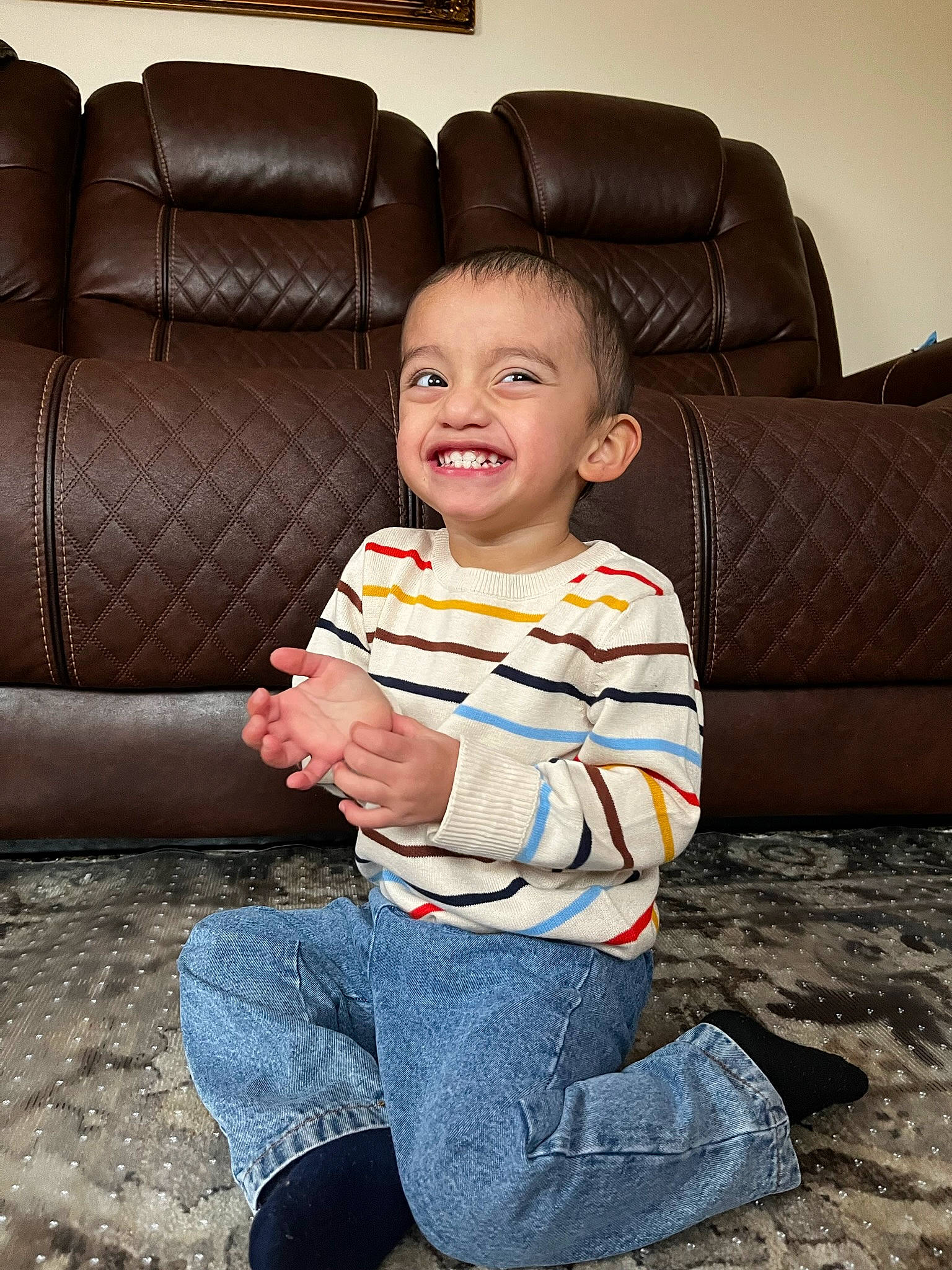 Jacob joined the competition — help win amazing prizes! baby_toddler_clothing, barefoot, child, comfort, couch, flooring, foot, fun, happy, human_leg, joy, lap, leisure, living_room, person, sitting, sleeve, smile, t_shirt, thigh
