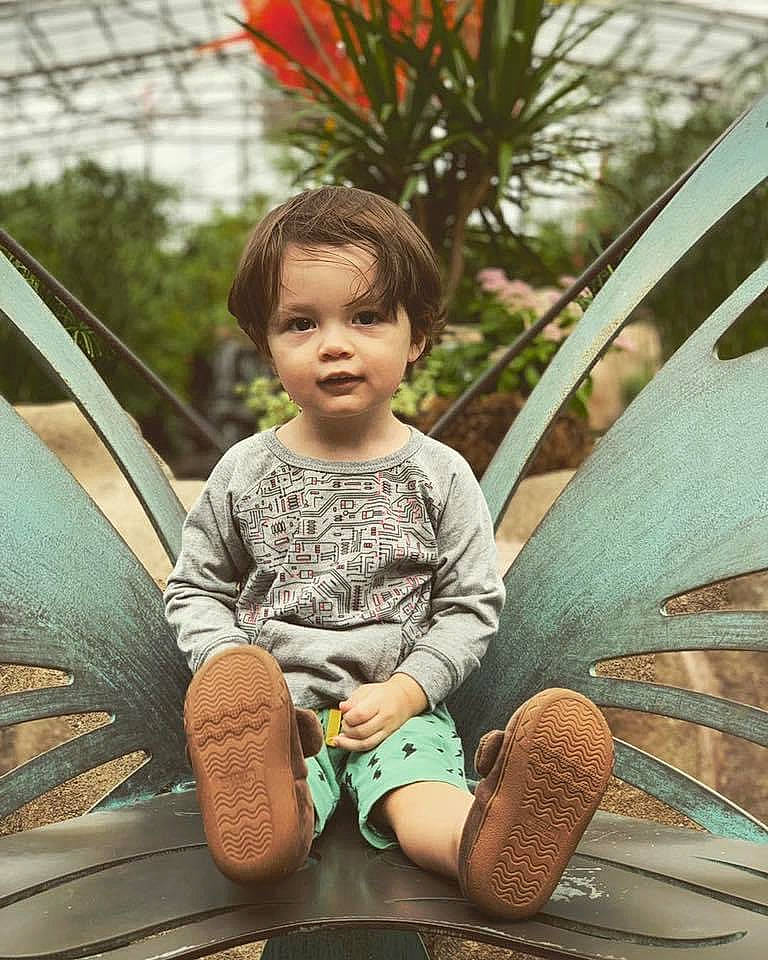 Axcel is registered to the contest to win money with this photo: agave, botany, child, child_model, cool, leisure, person, photography, plant, shorts, sitting, skin, smile, summer, toddler, tree, vacation