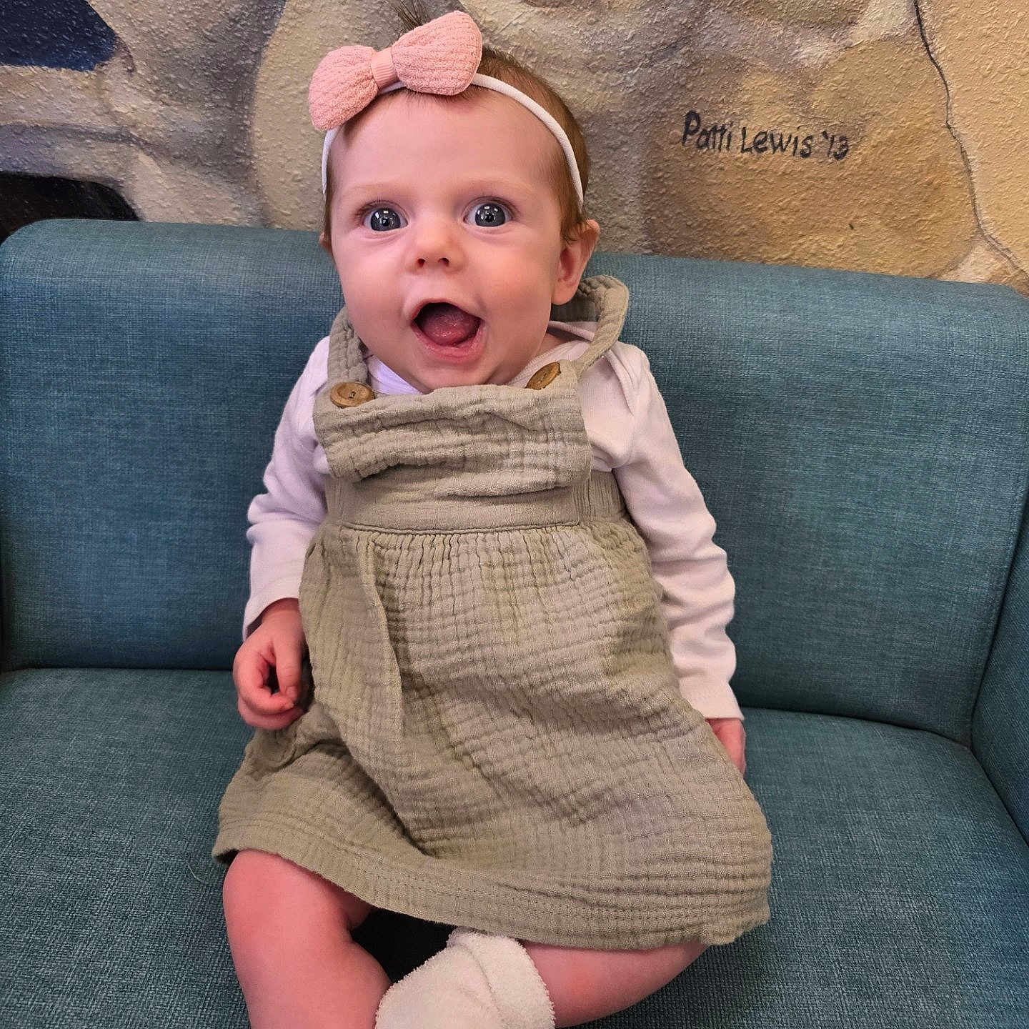 Ainsly joined the competition — help win amazing prizes! baby, babylaughing, clothing, dress, face, happy, head, person, photography, portrait, sitting, sleeve, yawning