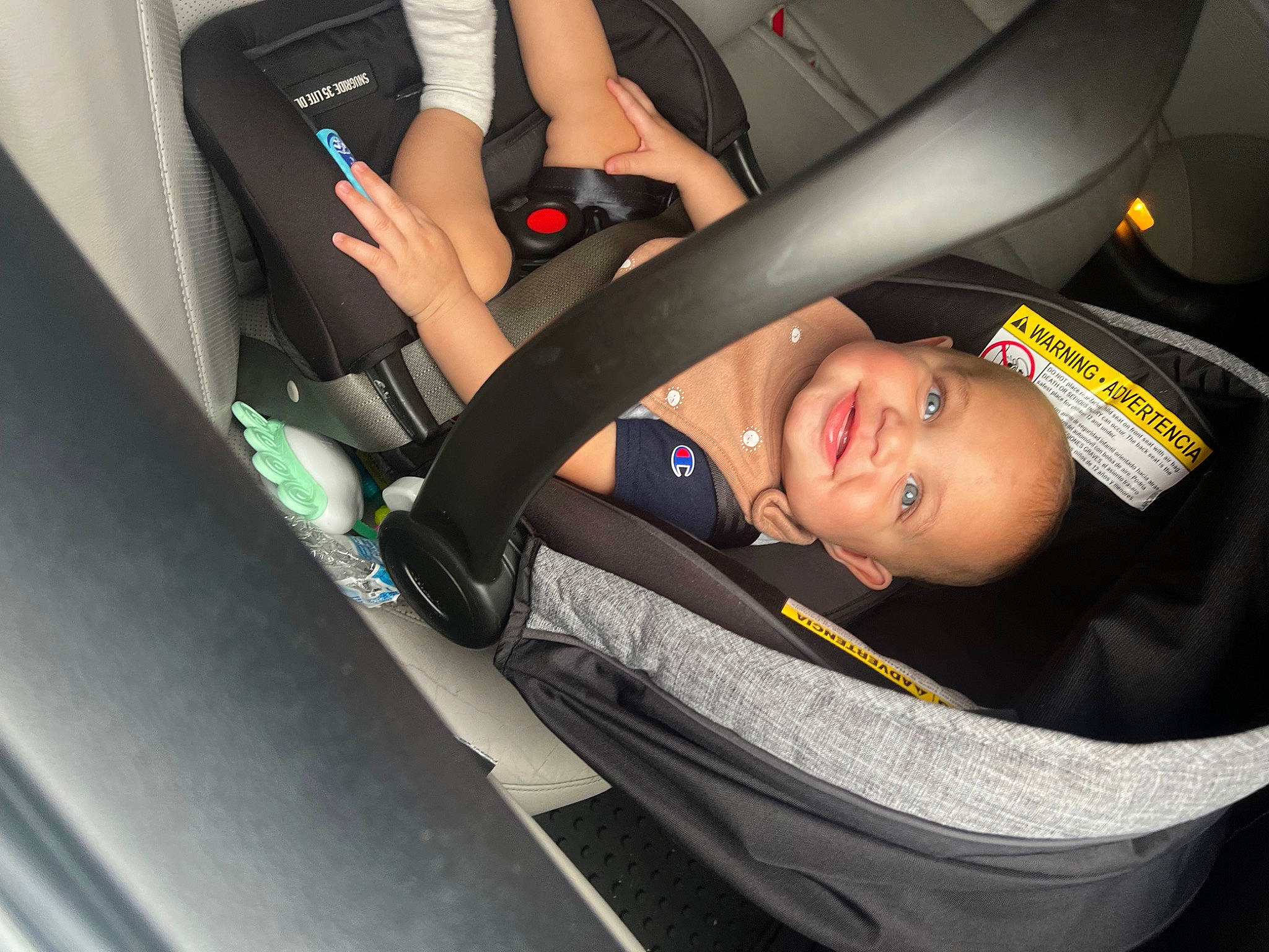 Amir is registered to the contest to win money with this photo: auto_part, automotive_design, automotive_exterior, automotive_tire, car, car_seat, car_seat_cover, comfort, flash_photography, fun, hand, human_leg, joy, motor_vehicle, person, personal_luxury_car, smile, thigh, toddler, vehicle