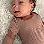 baby, infant, smiling, curly_hair, striped_clothing, onesie, lying_down, fluffy_rug, soft_texture, cute, happy, child, skin, face, arm, portrait, indoors, closeup, young, person