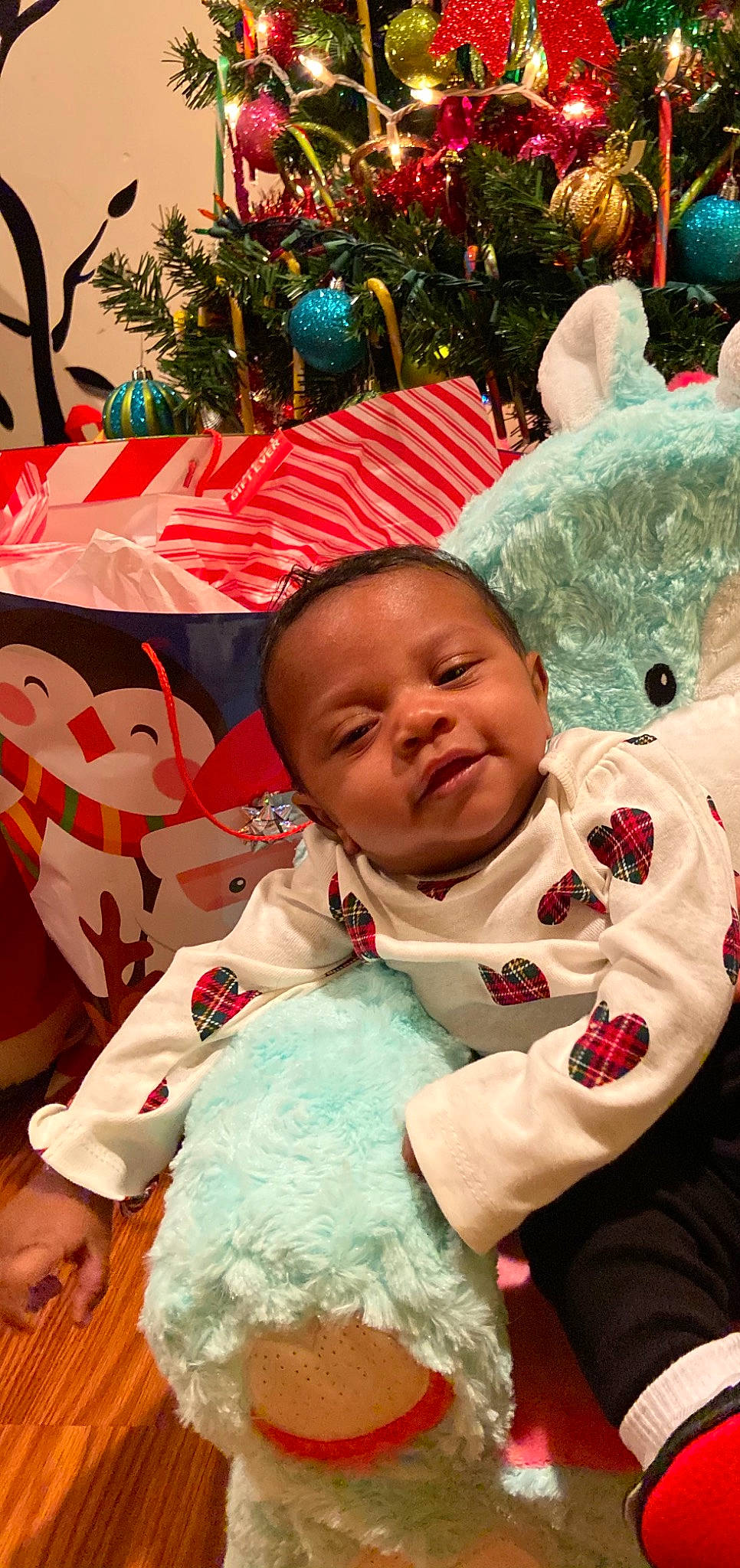 Unity joined the competition — help win amazing prizes! baby, baby_toddler_clothing, beauty, cheek, child, christmas_tree, event, eye, facial_expression, fun, green, happy, human, interaction, person, pink, red, skin, sleeve, toddler