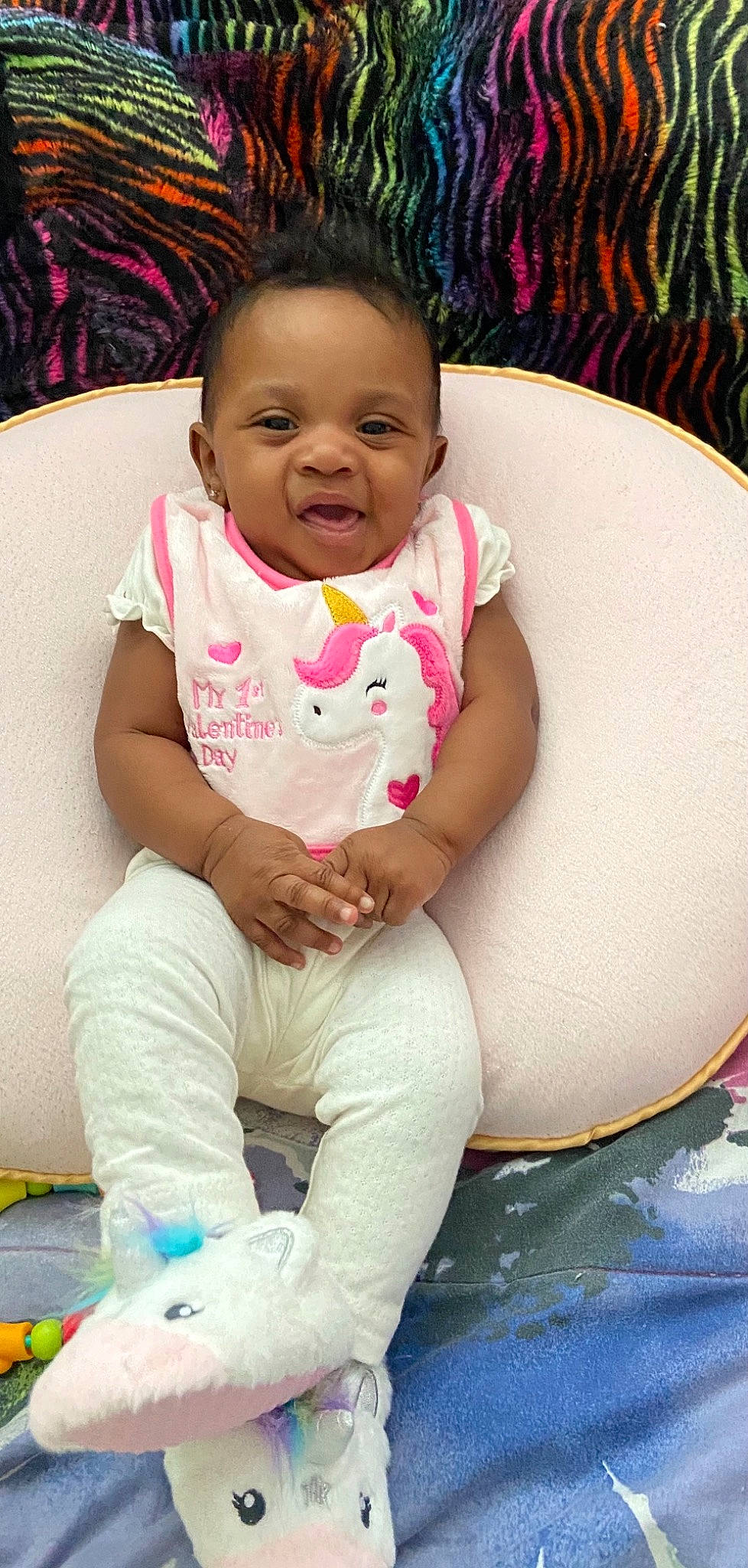 Unity is registered to the contest to win money with this photo: baby, baby_toddler_clothing, cheek, dress, eye, facial_expression, hairstyle, happy, head, iris, lip, mouth, nose, organ, person, product, purple, skin, sleeve, smile