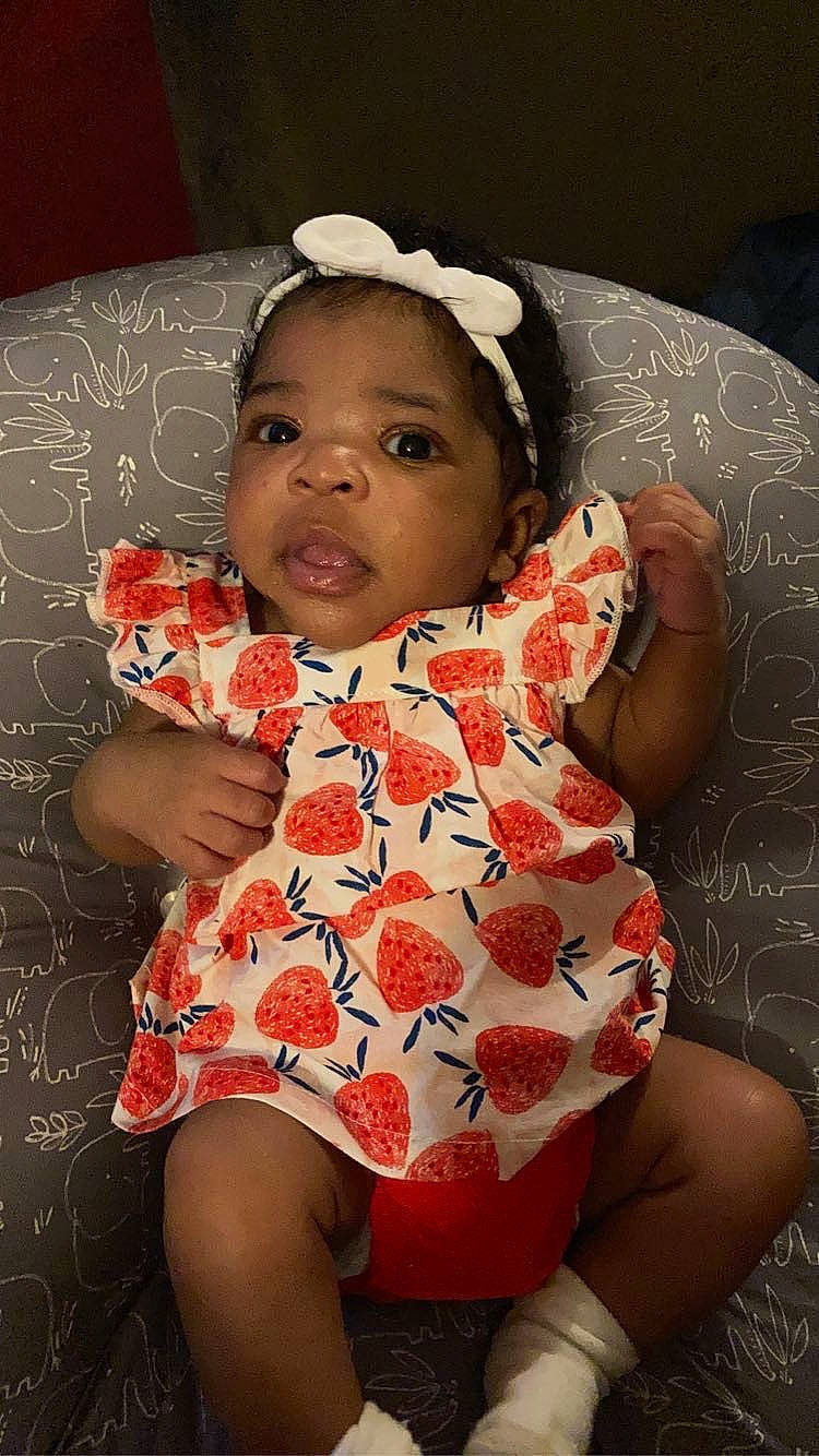 Kilani joined the competition — help win amazing prizes! baby, baby_toddler_clothing, cheek, dress, eye, face, flash_photography, happy, head, iris, lip, mouth, nose, organ, person, pink, skin, sleeve, standing, textile