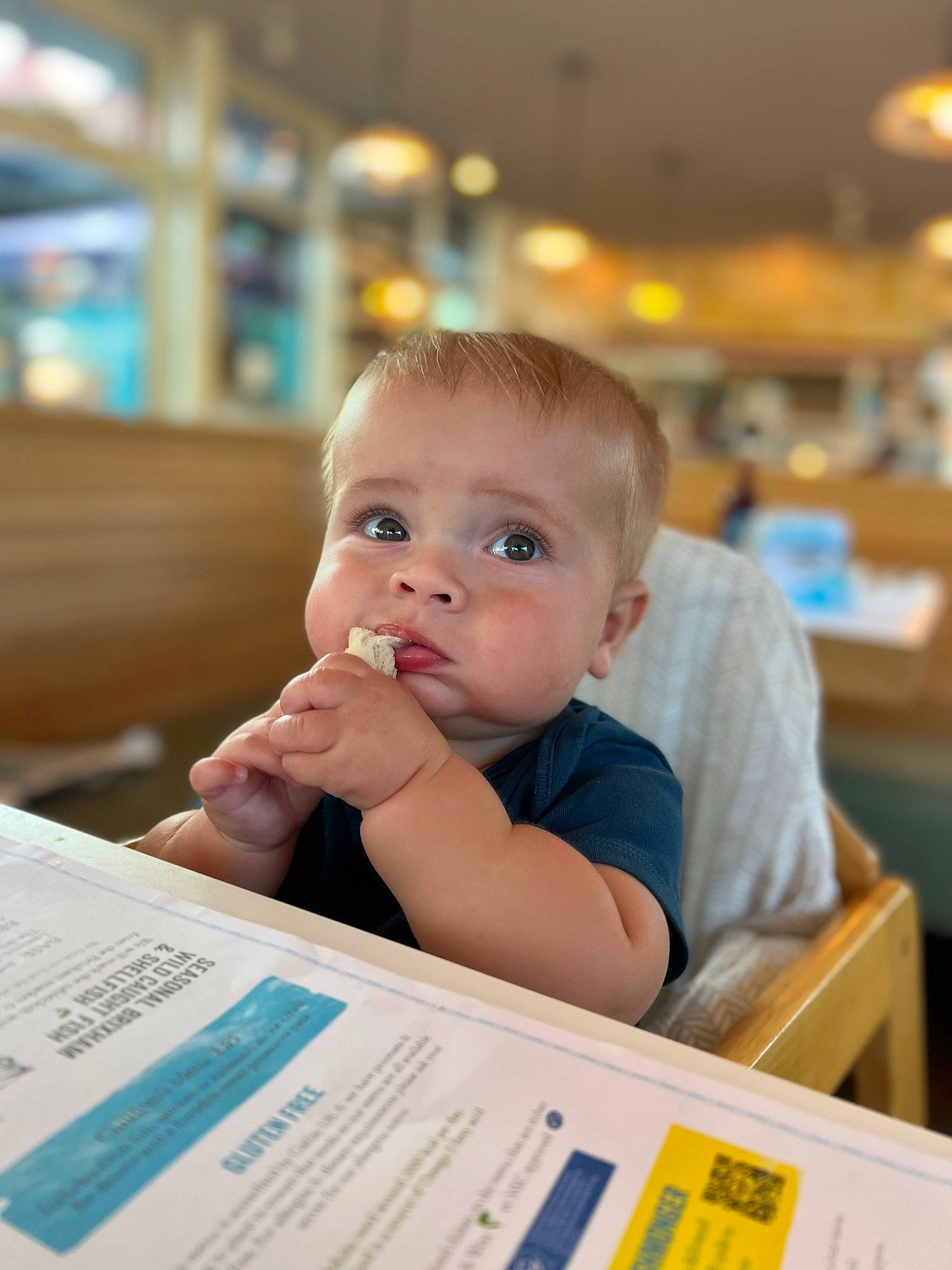 Harry is registered to the contest to win money with this photo: baby, chair, child, education, event, flooring, fun, happy, leisure, person, recreation, room, sitting, table, toddler, vacation
