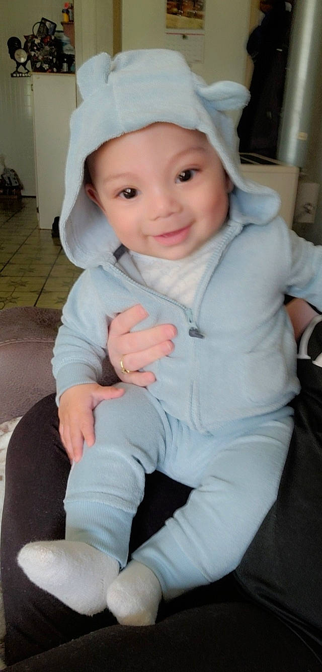 Bentlee joined the competition — help win amazing prizes! baby, baby_toddler_clothing, blond, cap, cheek, child, comfort, electric_blue, eyebrow, flooring, happy, headwear, human_leg, iris, joy, person, pink, sitting, skin, sleeve