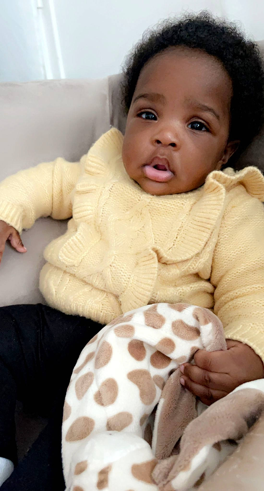 Kimyah participe au concours pour gagner de l'argent avec cette photo : arm, baby, baby_toddler_clothing, black, cheek, chin, comfort, eye, face, facial_expression, head, human_body, lip, neck, nose, outerwear, person, skin, sleeve, textile