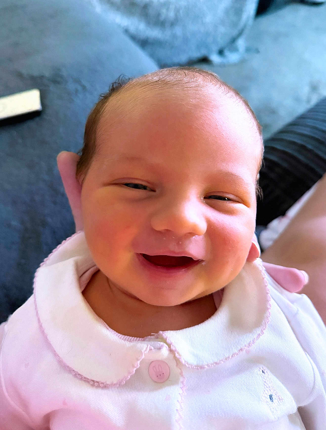 Halo joined the competition — help win amazing prizes! baby, smiling, infant, face, pink_clothing, cute, portrait, person, newborn, happy, closeup, soft_lighting, indoors, couch, button, bunny, collar, skin, head, expression