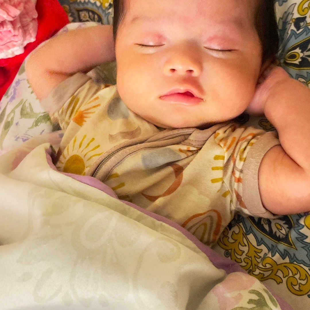 Hnnah joined the competition — help win amazing prizes! baby, bed, blanket, child, comfort, cozy, cute, fabric, face, hair, indoors, infant, pattern, peaceful, person, pillow, relaxed, rest, sleeping, soft_lighting