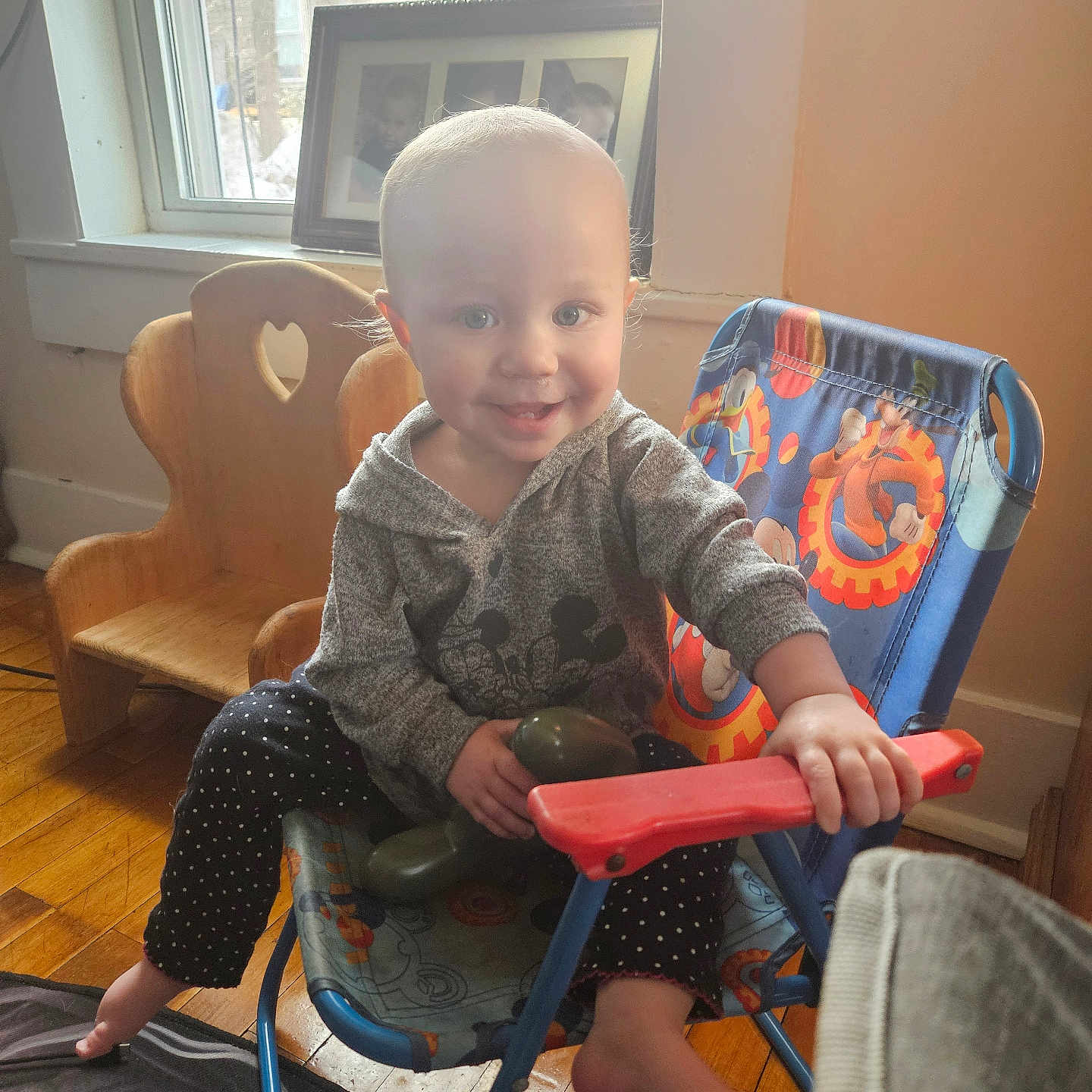 Scarlett is registered to the contest to win money with this photo: architecture, baby, building, chair, clothing, cushion, face, furniture, head, homedecor, indoors, interiordesign, livingroom, pants, person, photography, portrait, room, sitting, wood