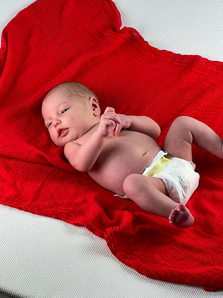 Noah joined the competition — help win amazing prizes! abdomen, baby, baby_sleeping, baby_toddler_clothing, bedding, bedtime, chest, child, comfort, finger, foot, human_leg, knee, linens, magenta, person, pink, skin, textile, thigh