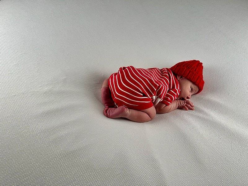 Noah joined the competition — help win amazing prizes! baby, baby_sleeping, baby_toddler_clothing, cap, carmine, comfort, eye, fictional_character, flooring, foot, happy, headgear, headwear, human_body, knit_cap, linens, pattern, person, sleeve, t_shirt