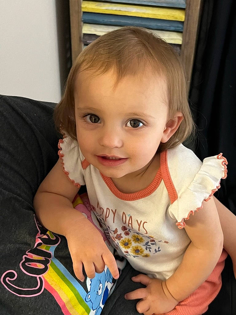 Olive joined the competition — help win amazing prizes! arm, baby_toddler_clothing, blond, cheek, child, curtain, eye, eyelash, finger, fun, gesture, hand, happy, iris, joy, person, picture_frame, sleeve, smile, t_shirt