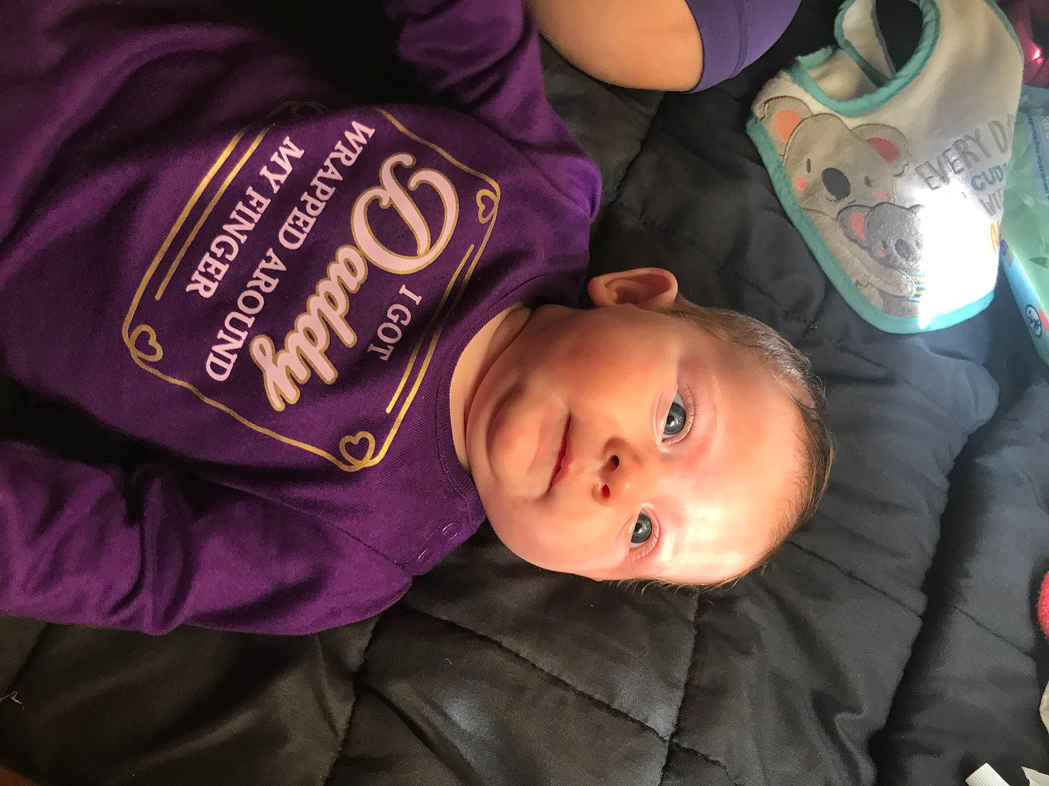 Alaska is registered to the contest to win money with this photo: baby, baby_toddler_clothing, cheek, child, comfort, cool, eye, facial_expression, fun, happy, hat, head, headgear, magenta, person, sitting, skin, sleeve, smile, toddler